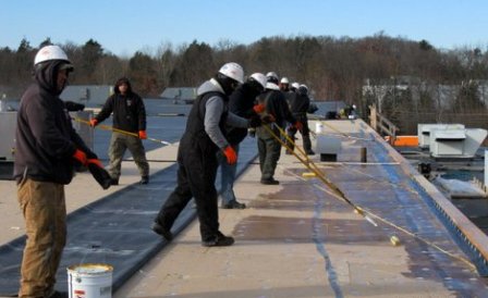 NorthStar Construction Laying Rubber Roof